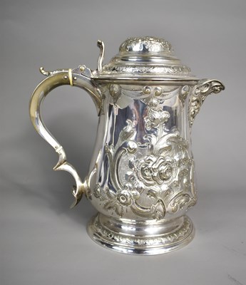 Lot 3 - A Georgian silver plated tankard with hinged...