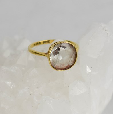 Lot 432 - An 18ct gold and rock crystal dress ring, the...