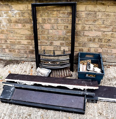 Lot 443 - An early 19th century fireplace in a dark grey...