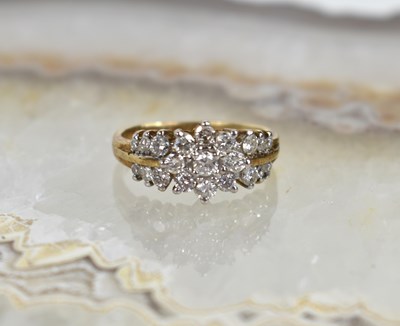 Lot 122 - A 9ct gold and diamond flowerhead cluster ring,...