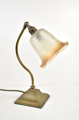 Lot 354 - An early 20th century desk lamp with brass...