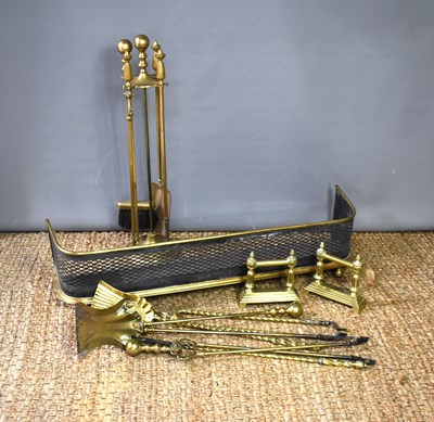 Lot 404 - A Victorian brass four-piece fire companion...