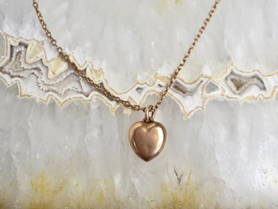 Lot 108 - A gold heart shaped pendant and necklace,...