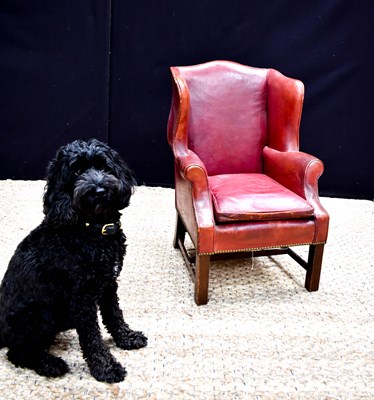 Lot 455 - A 19th century child’s wingback armchair in...