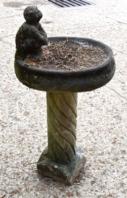 Lot 505 - A vintage garden bird bath with spiral column,...