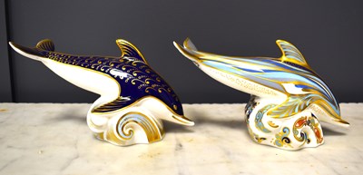 Lot 62 - Two Royal Crown Derby paperweights of dolphins,...