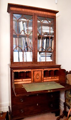Lot 470 - A George III mahogany secretaire bookcase, the...