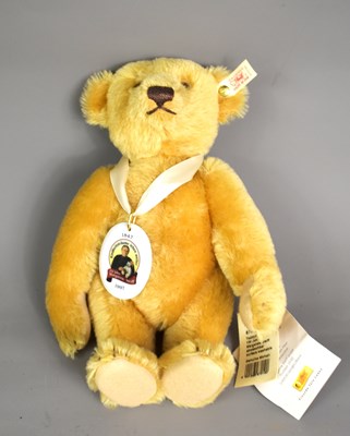 Lot 210 - A small golden plush teddy bear by Steiff ltd...