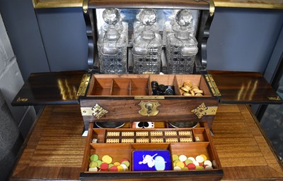 Lot 299 - A fine 19th century tantalus and games...
