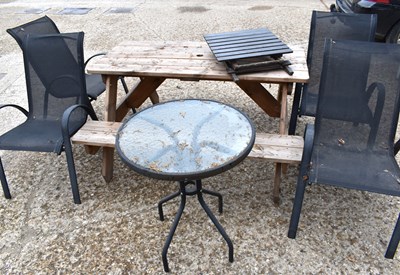 Lot 504 - A wooden picnic bench plus a small round glass...