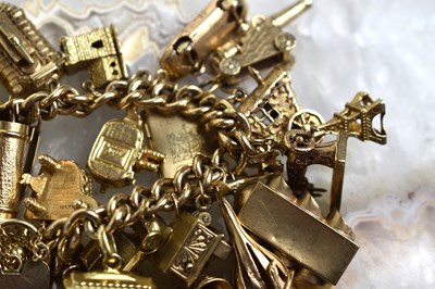 Lot 169 - A fine 9ct gold charm bracelet with 24 charms...