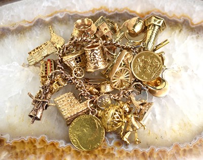 Lot 164 - A 9ct gold charm bracelet, the chain...