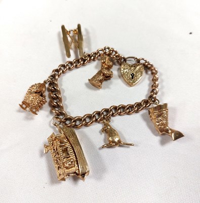 Lot 142 - A 9ct gold charm bracelet with six charms...