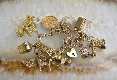 Lot 157 - A 9ct gold charm bracelet consisting of...