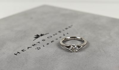 Lot 121 - An 18ct white gold Hearts on Fire diamond...