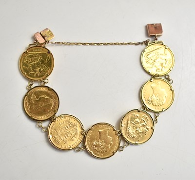Lot 156 - A gold half sovereign articulated bracelet...