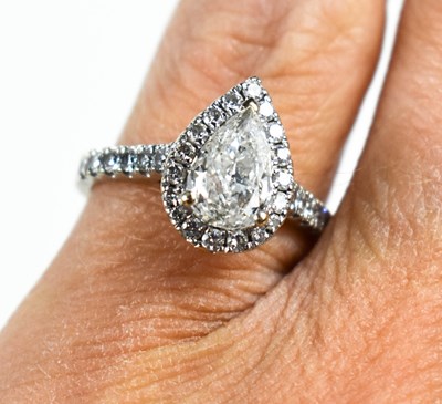 Lot 120 - An 18ct white gold and pear cut diamond...
