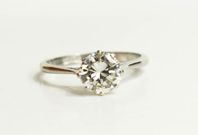 Lot 125 - A platinum solitaire ring set to the centre...