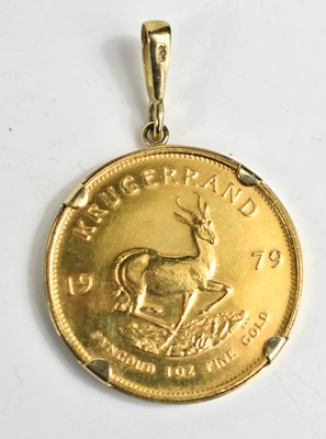Lot 165 - A 1979 Krugerrand mounted in 9ct plain band...