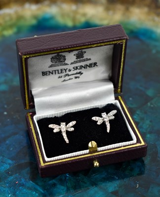 Lot 127 - A pair of diamond dragonfly earrings, set...