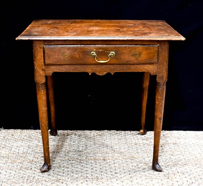 Lot 436 - A George III oak lowboy, the moulded top above...