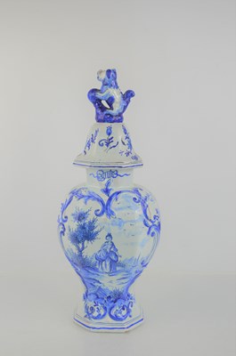 Lot 176 - A 19th century delftware vase and cover,...