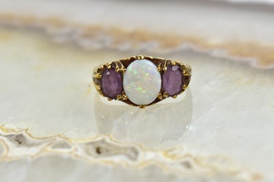 Lot 187 - A 9ct gold, opal and amethyst ring, size U, 4.5g.