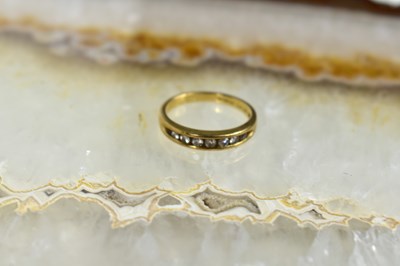 Lot 49 - A 9ct gold and diamond half hoop eternity ring,...