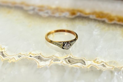 Lot 155 - An 18ct gold and diamond solitaire ring, size...