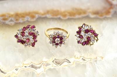Lot 174 - A 9ct gold, diamond and ruby cluster ring,...