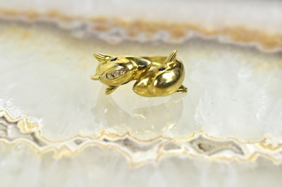 Lot 169 - A 15ct gold twin dolphin ring set with...