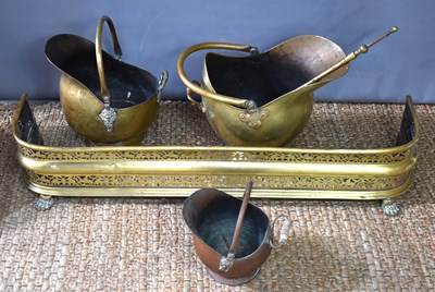 Lot 272 - An antique pierced brass fire fender together...