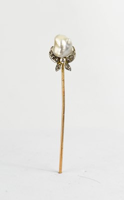 Lot 379 - A stock pin set with a baroque pearl above...