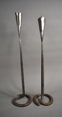 Lot 271 - A pair of wrought iron candlesticks by...