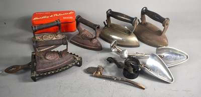 Lot 265 - A group of cast iron and early electric irons...