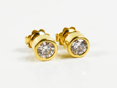 Lot 29 - A pair of 9ct gold and diamond stud earrings,...
