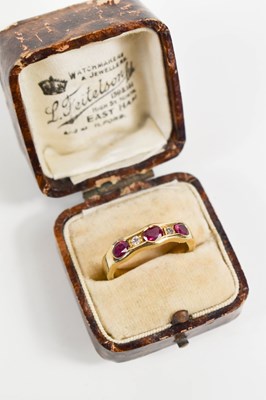 Lot 14 - A 10ct gold, diamond and ruby ring, the three...