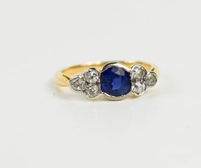 Lot 18 - A 9ct gold, sapphire and diamond ring, the...