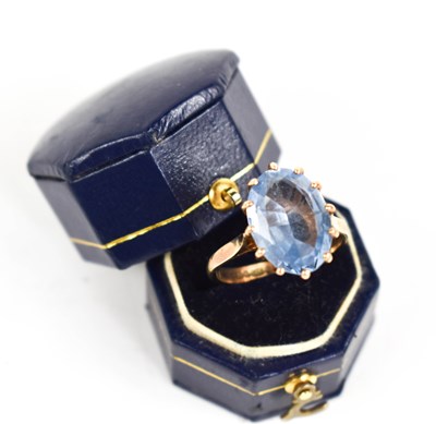 Lot 90 - A 9ct gold and blue topaz ring, the oval cut...