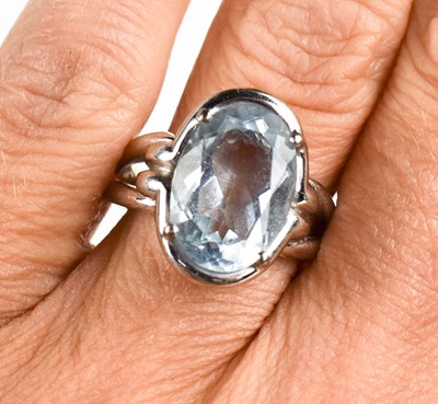 Lot 24 - An 18ct white gold and aquamarine ring, the...