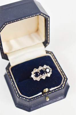 Lot 26 - An 18ct white gold, diamond and three stone...