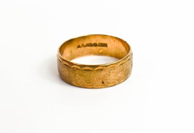 Lot 101 - A 9ct gold wedding band, size R/S, 3.6 grams