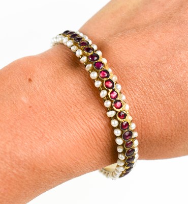 Lot 9 - A Georgian gilt metal, seed pearl and garnet...