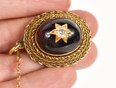 Lot 32 - A Georgian diamond and garnet cabochon...