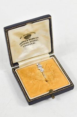Lot 21 - An 18ct white gold and diamond three stone...