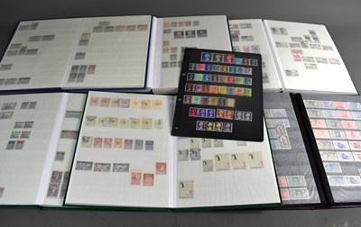 Lot 198 - A group of six stamp albums and stock books to...