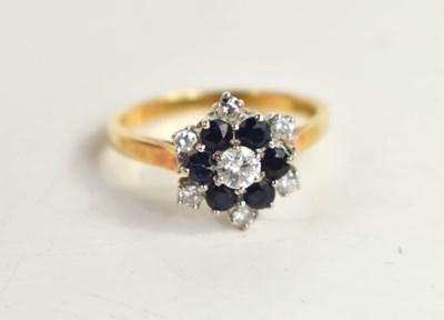 Lot 76 - An 18ct gold, diamond and sapphire flowerhead...