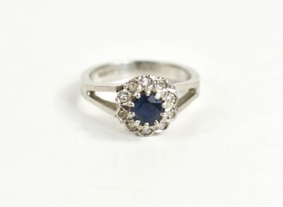 Lot 65 - A silver, diamond and sapphire flowerhead ring,...
