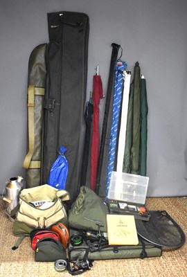 Lot 231 - A collection of fishing tackle to include rods...