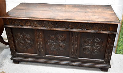 Lot 337 - A 17th century oak coffer, with planked lid,...